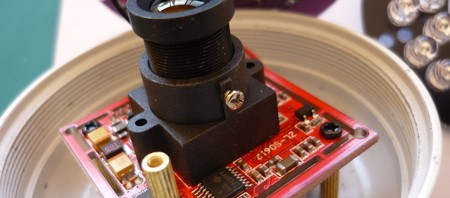 Picture showing the screw on the lens that aligns with the IR board notch